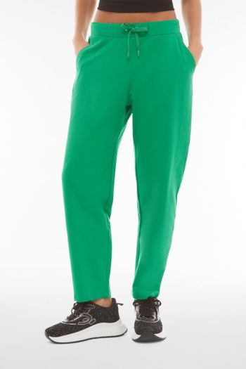 Pantaloni carrot fit in french terry con grafica sul fondo Verde