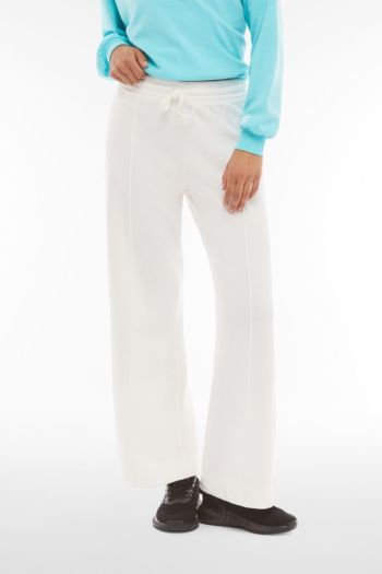 Women's wide trousers in French terry decorated with central piping